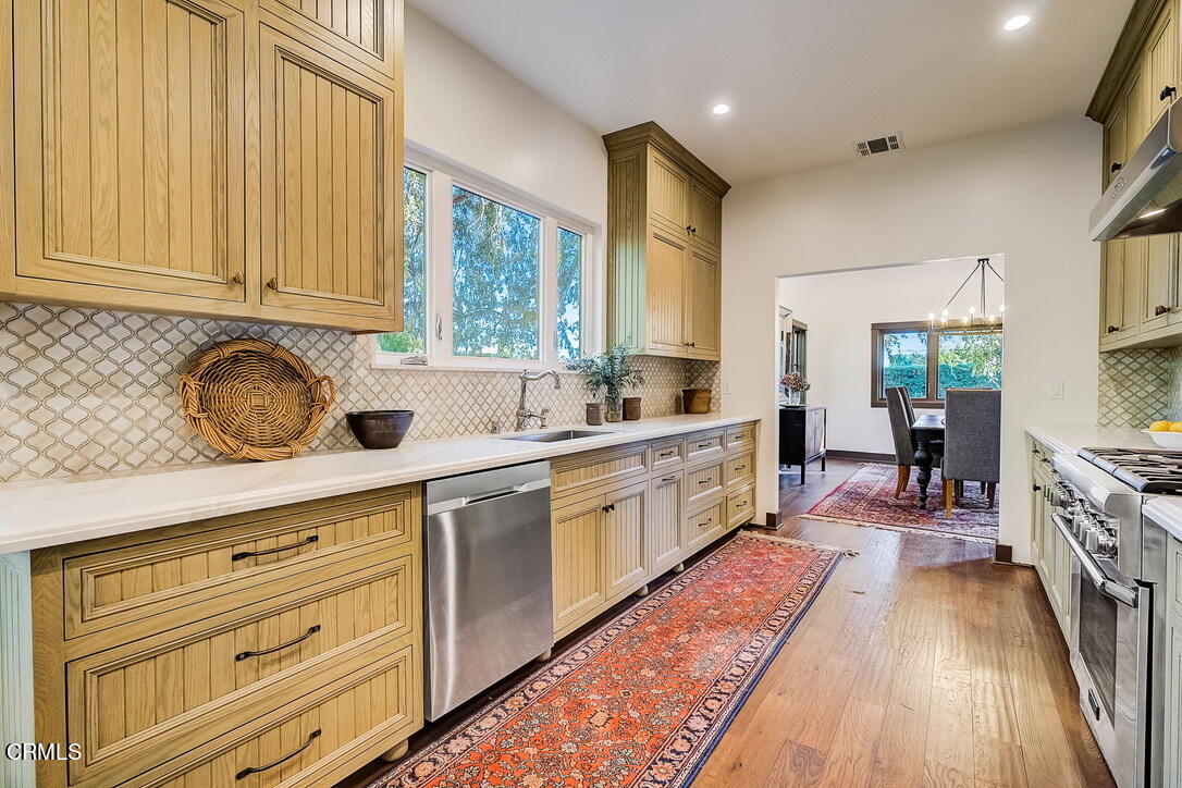 1717 East Mendocino Street Altadena, CA 91001 - Photo 13 of 68 a kitchen with cabinets a sink and appliances