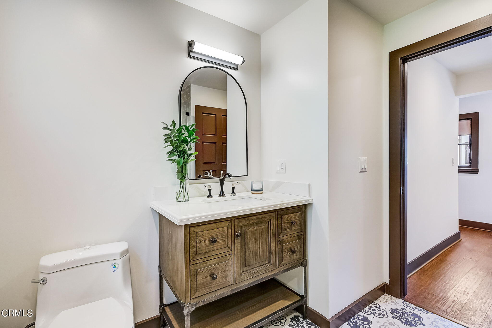 1717 East Mendocino Street Altadena, CA 91001 - Photo 27 of 68 a bathroom with a toilet sink and mirror