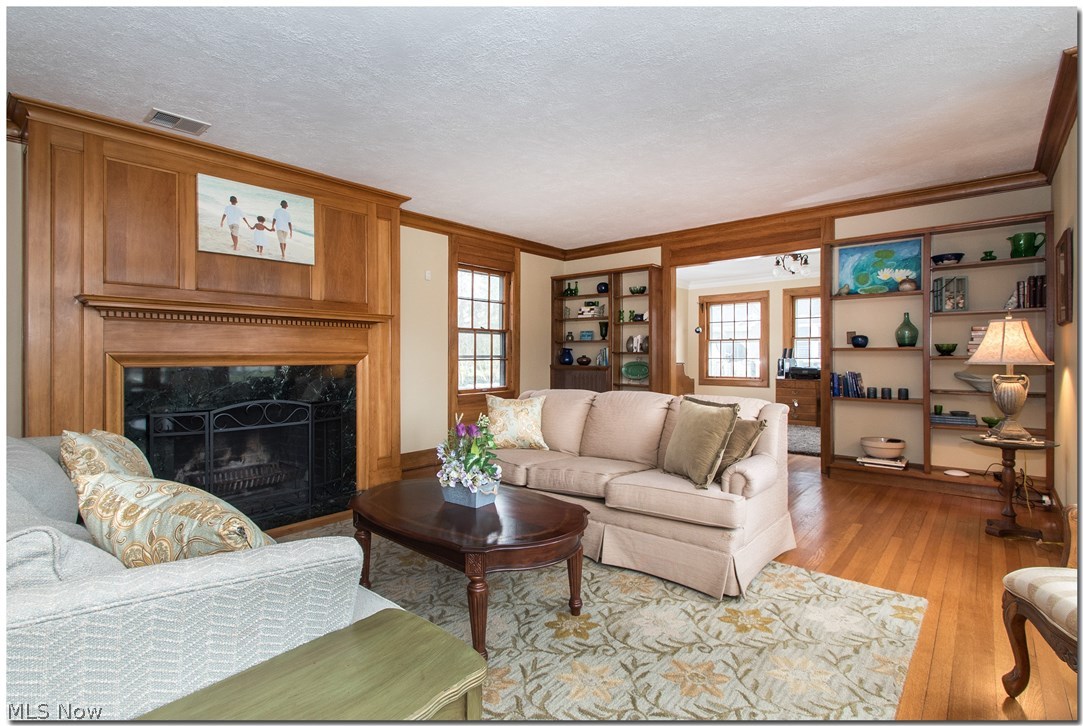 2879 Fontenay Road Cleveland, OH 44120 - Photo 3 of 35 Spacious Living Room with woodburning fpl, built-in shelving and natural woods