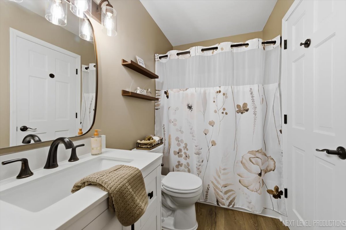 10 Shermead Road Montgomery, IL 60538 - Photo 19 of 30 a bathroom with a sink toilet and shower