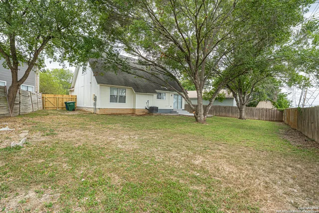 a house with trees in the background