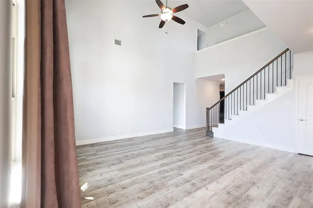 a view of an entryway with wooden floor