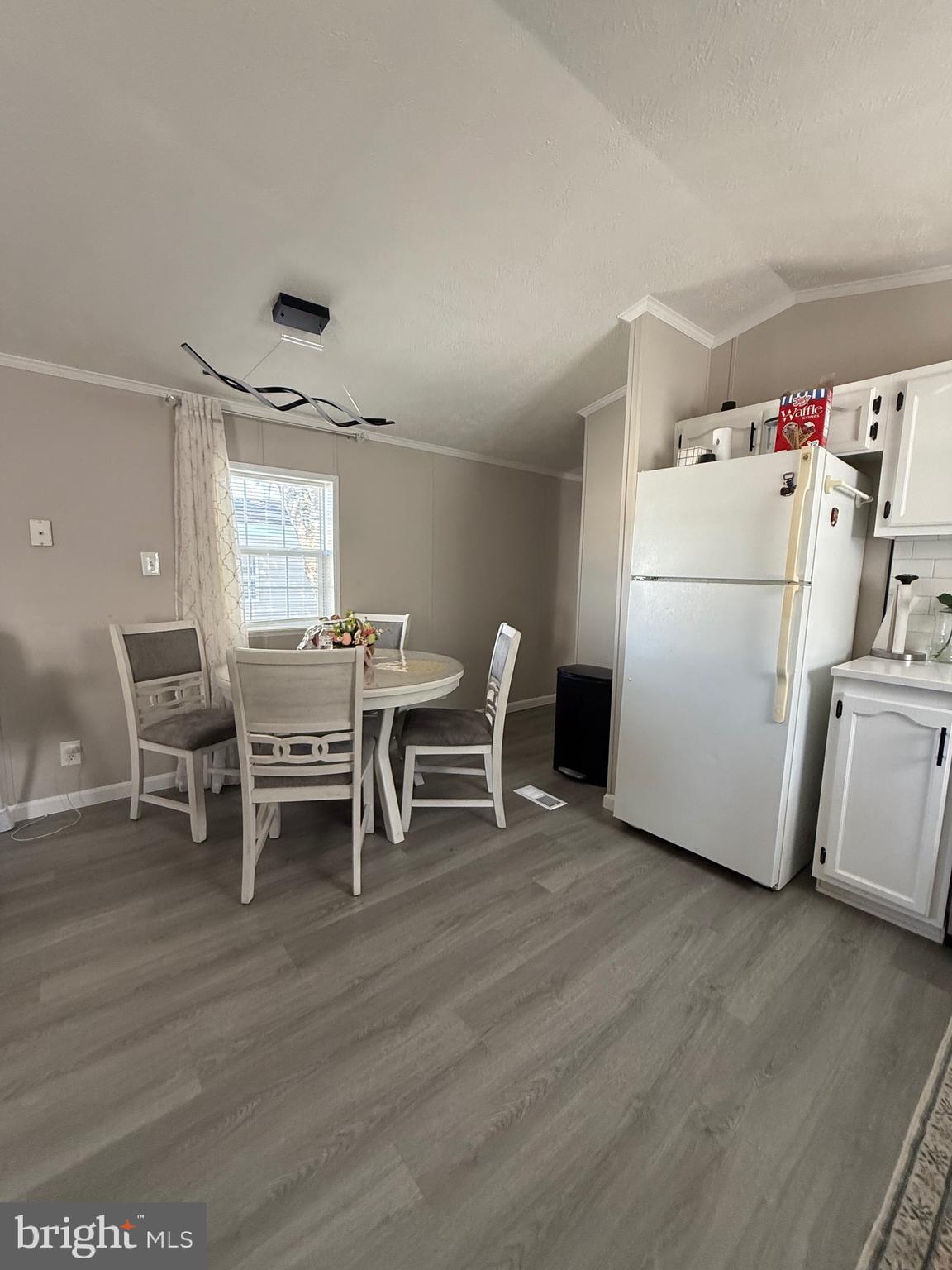7959 Telegraph Road Severn, MD 21144 - Photo 11 of 18 a white table sitting in a kitchen with table and chairs