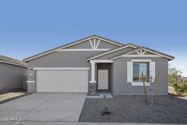 a front view of a house with a garage