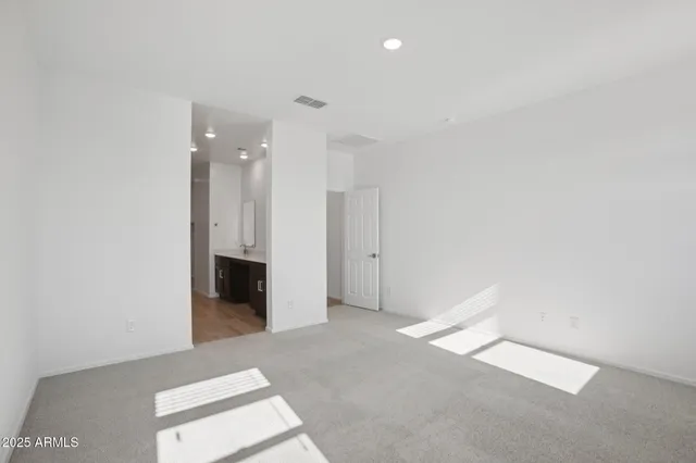 a view of an empty room with a fireplace