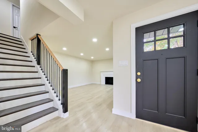 a kitchen with a stove top oven and refrigerator