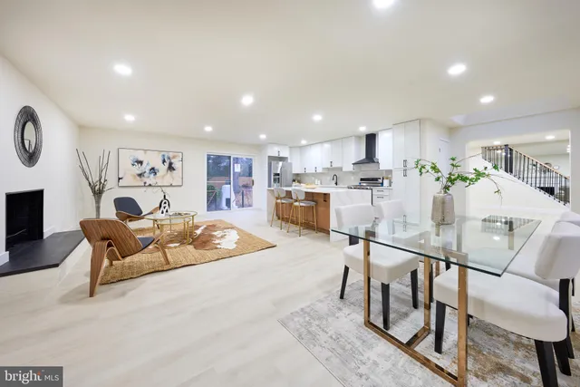 a spacious bedroom with a bed and a couch