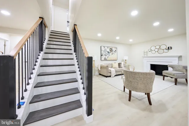 a bathroom with a double vanity sink mirror and bathtub