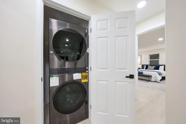 a view of an empty room with closet area