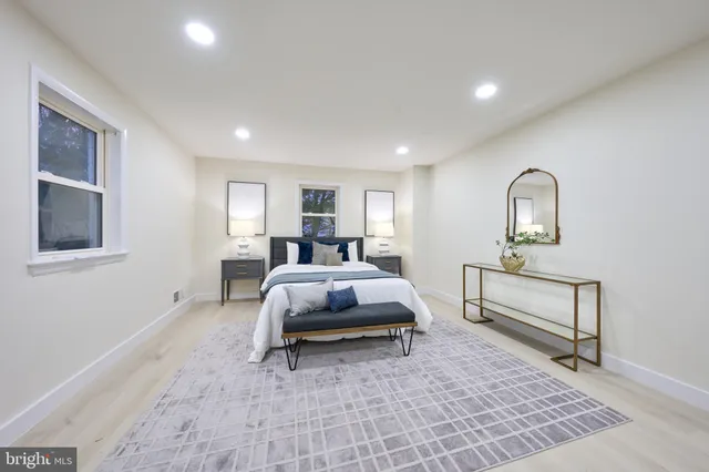 a view of a kitchen with stainless steel appliances cabinets