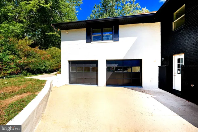 a view of entryway with wooden floor and windows