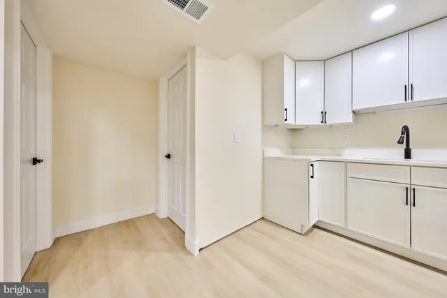 a view of a swimming pool with a bench