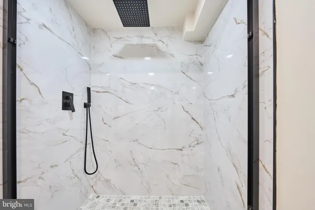 a large kitchen with kitchen island a sink stainless steel appliances and cabinets