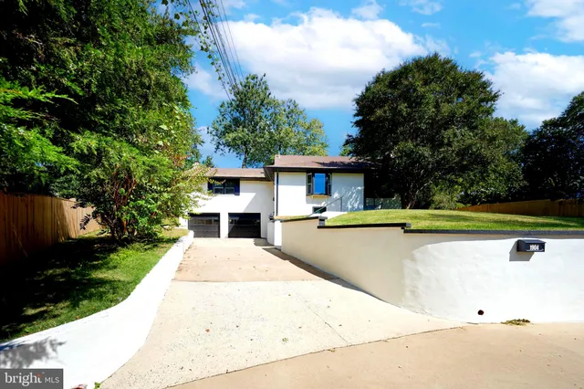 a view of entryway with wooden floor and windows