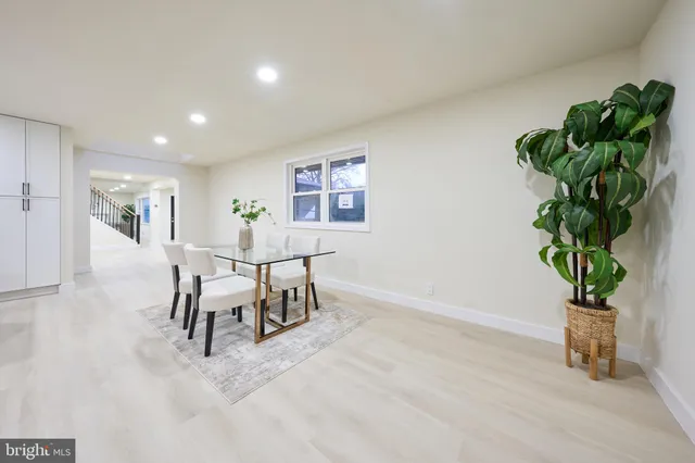 a view of a room with furniture and a potted plant