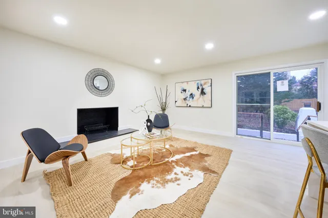 a living room with furniture and a mirror