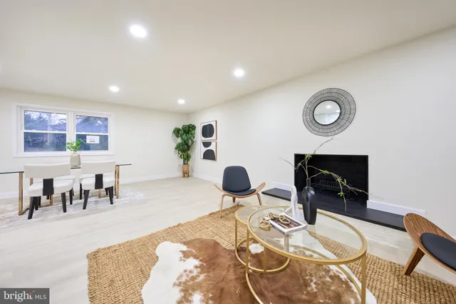 a view of a livingroom with furniture and a potted plant