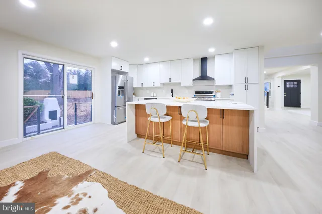 a living room with furniture a table and a fireplace