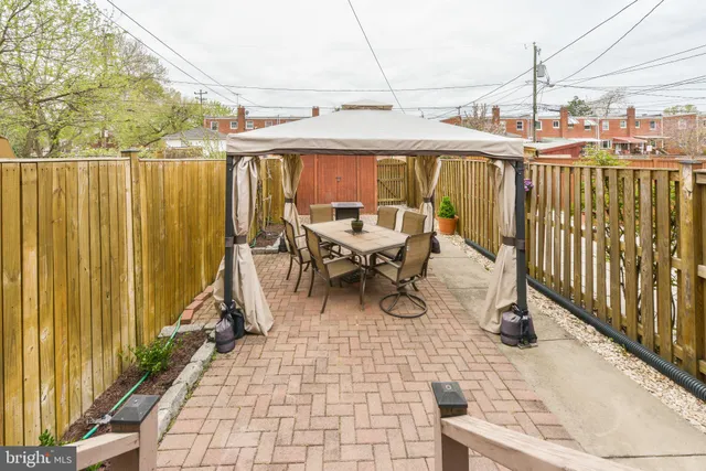 a view of a chairs and table in the balcony