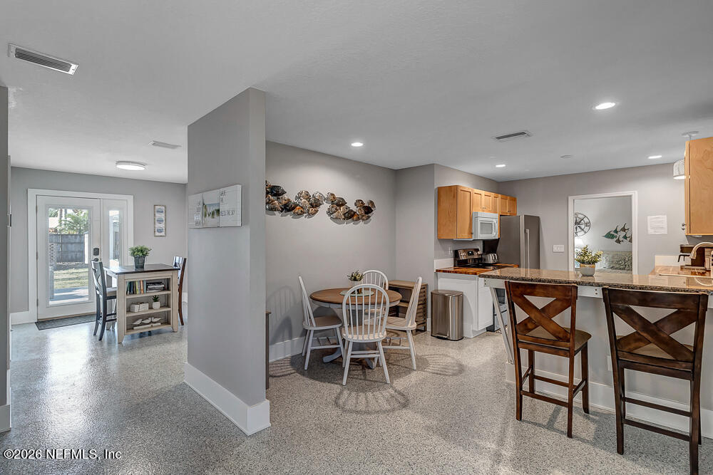 5437 3rd Street St. Augustine, FL 32080 - Photo 11 of 35 a view of a dining room with furniture