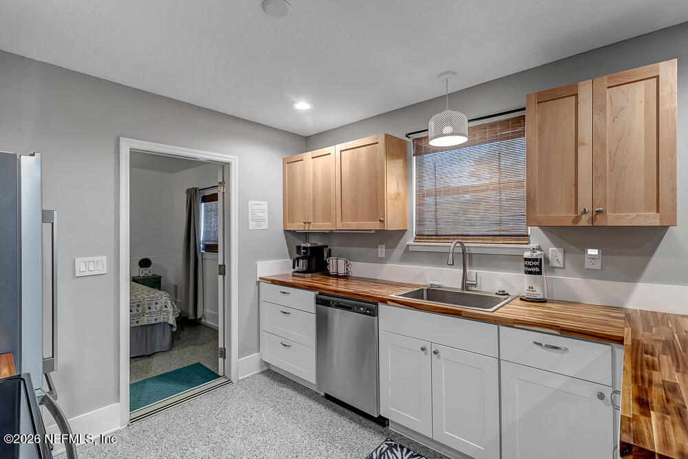 5437 3rd Street St. Augustine, FL 32080 - Photo 14 of 35 a kitchen with a sink cabinets and window