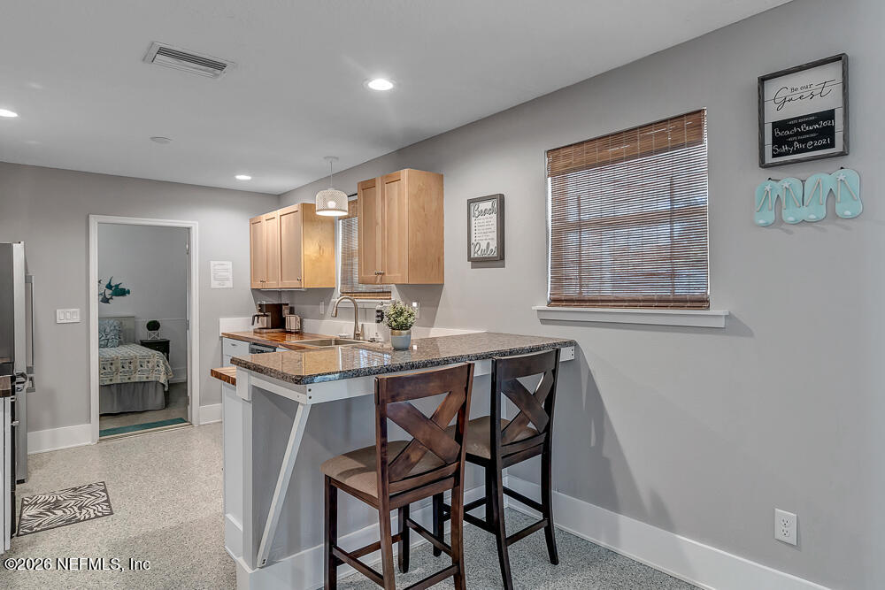 5437 3rd Street St. Augustine, FL 32080 - Photo 16 of 35 a view of a dining room with furniture and window