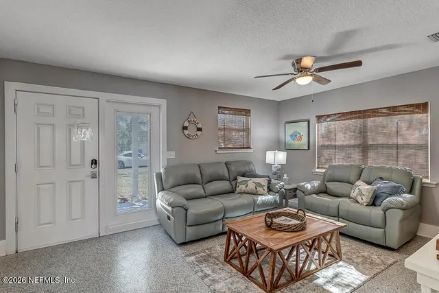 a living room with furniture and a window