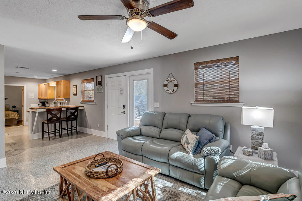 5437 3rd Street St. Augustine, FL 32080 - Photo 10 of 35 a living room with furniture and a table