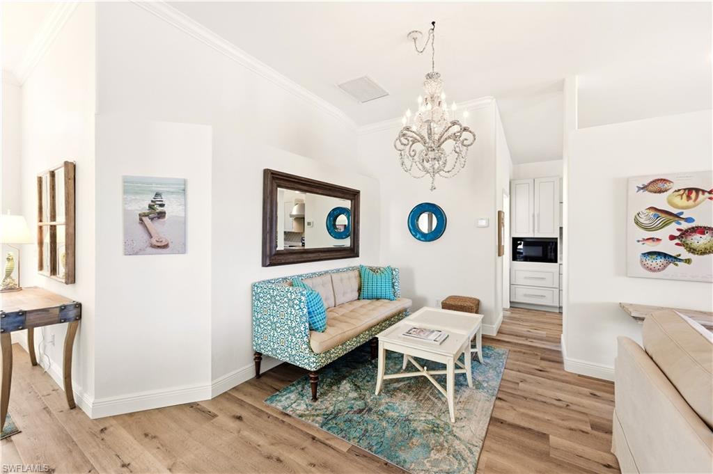 1777 Marsh Run Naples, FL 34109 - Photo 13 of 34 a living room with furniture and a table