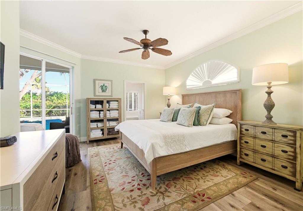 1777 Marsh Run Naples, FL 34109 - Photo 17 of 34 a bedroom with a bed a window and dresser