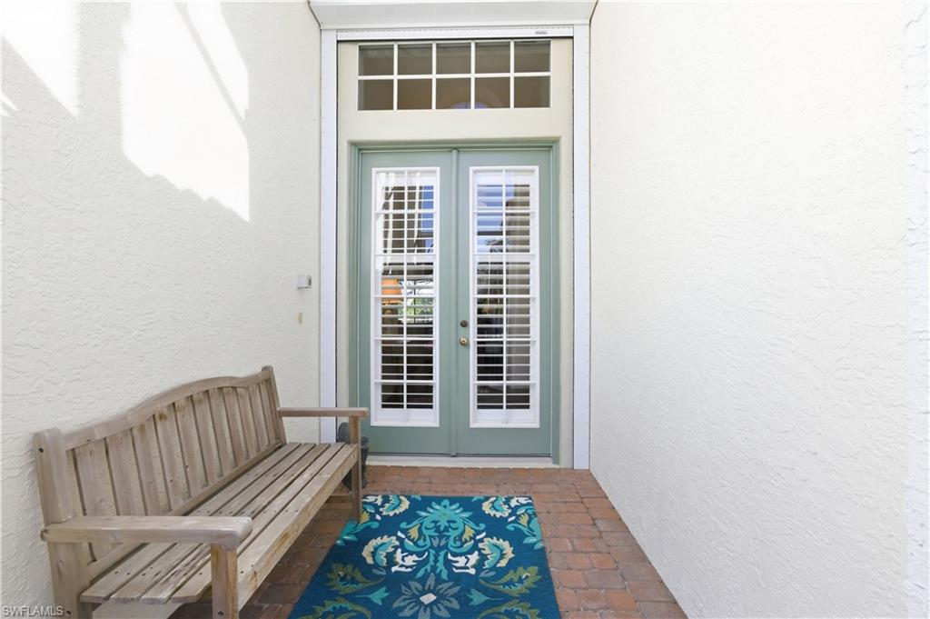 1777 Marsh Run Naples, FL 34109 - Photo 2 of 34 a view of front door with chair