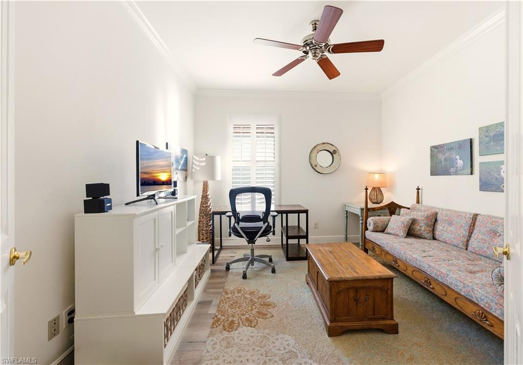 1777 Marsh Run Naples, FL 34109 - Photo 10 of 34 a living room with furniture and a flat screen tv