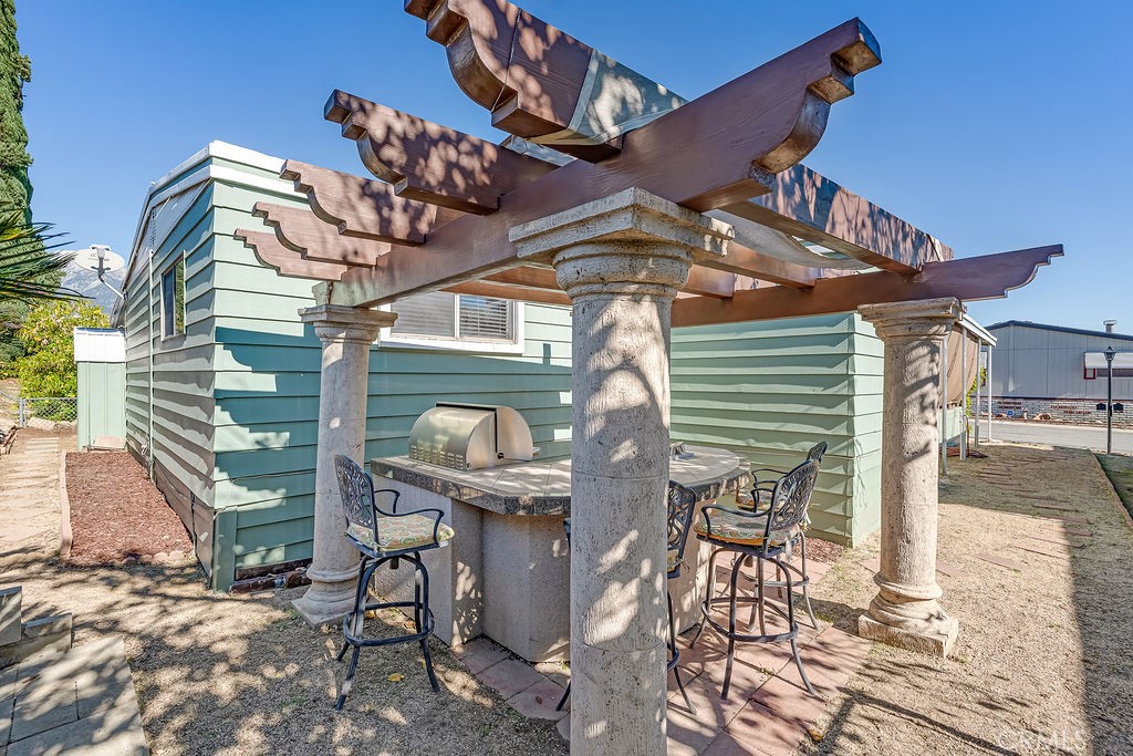 9999 Foothill Boulevard, Unit 48 Rancho Cucamonga, CA 91730 - Photo 34 of 38 BBQ Island and pillars/gazebo to be removed prior to closing. Not included in sale.