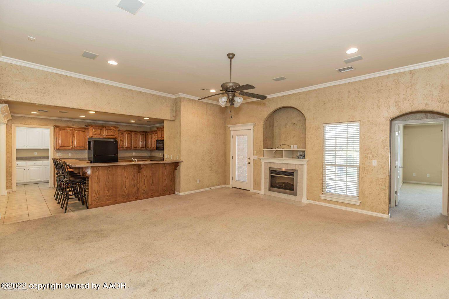 5801 South Rusk Street Amarillo, TX 79118 - Photo 4 of 27 a view of a kitchen with a sink and a fireplace