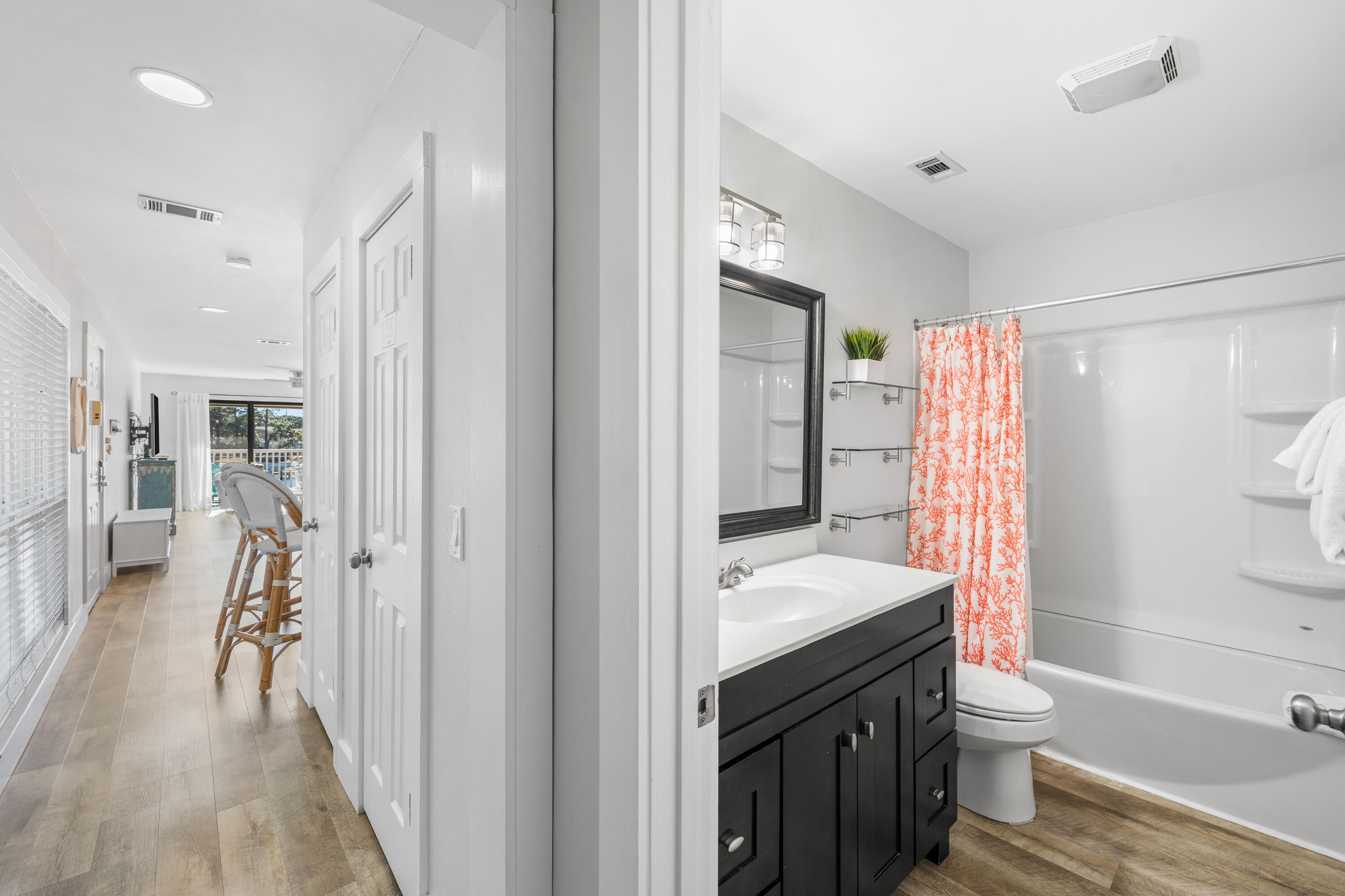 911 Harbour Point Lane, Unit 911 Miramar Beach, FL 32550 - Photo 13 of 40 a bathroom with a sink a toilet and shower