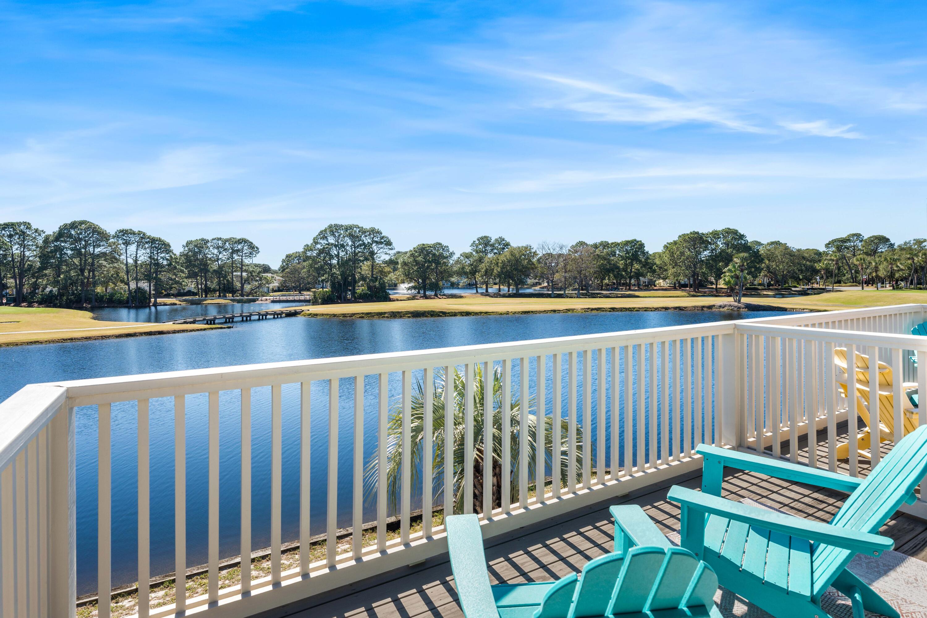 911 Harbour Point Lane, Unit 911 Miramar Beach, FL 32550 - Photo 18 of 40 a balcony with wooden floor and lake view