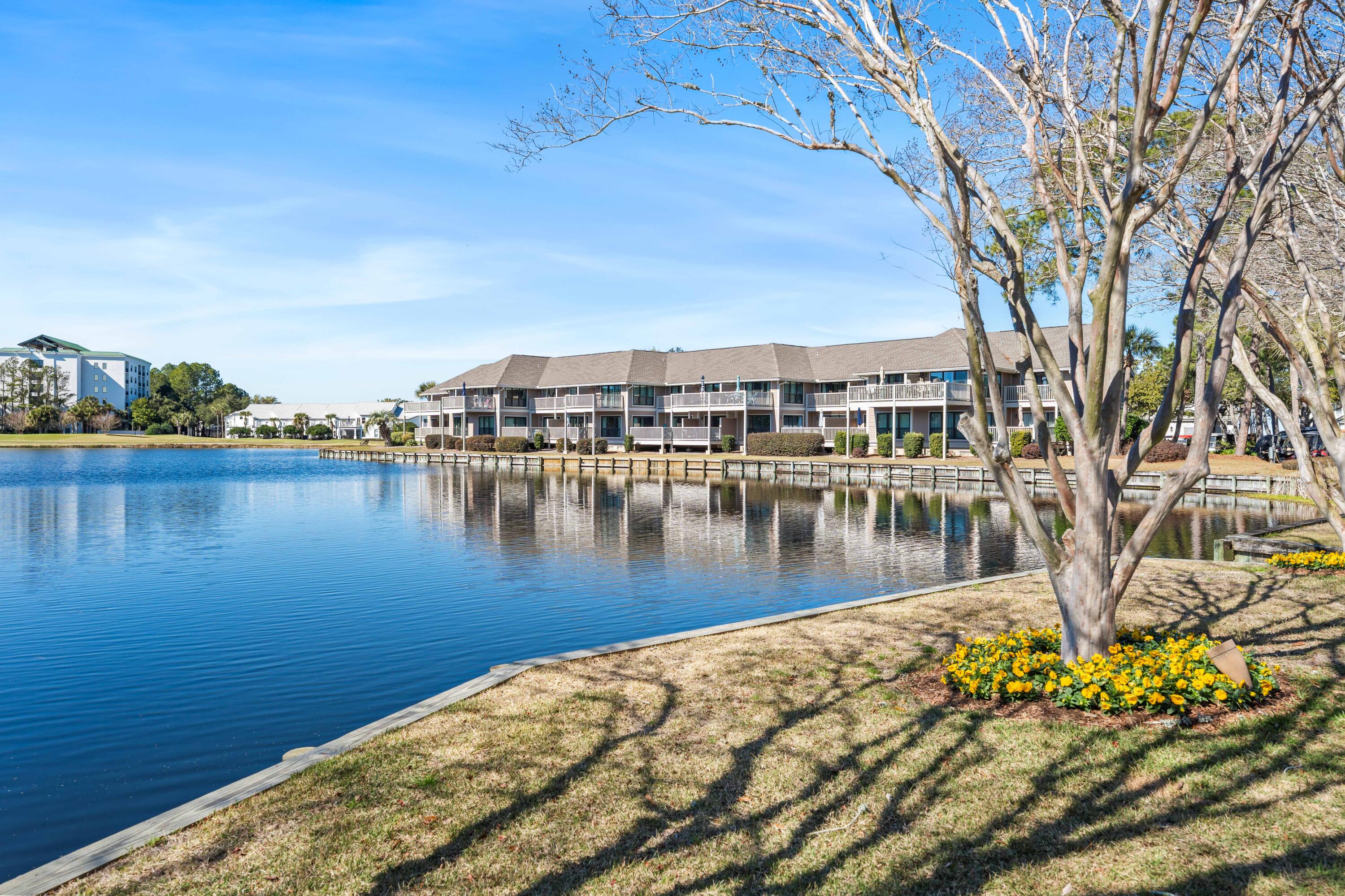 911 Harbour Point Lane, Unit 911 Miramar Beach, FL 32550 - Photo 19 of 40 a view of a lake with houses
