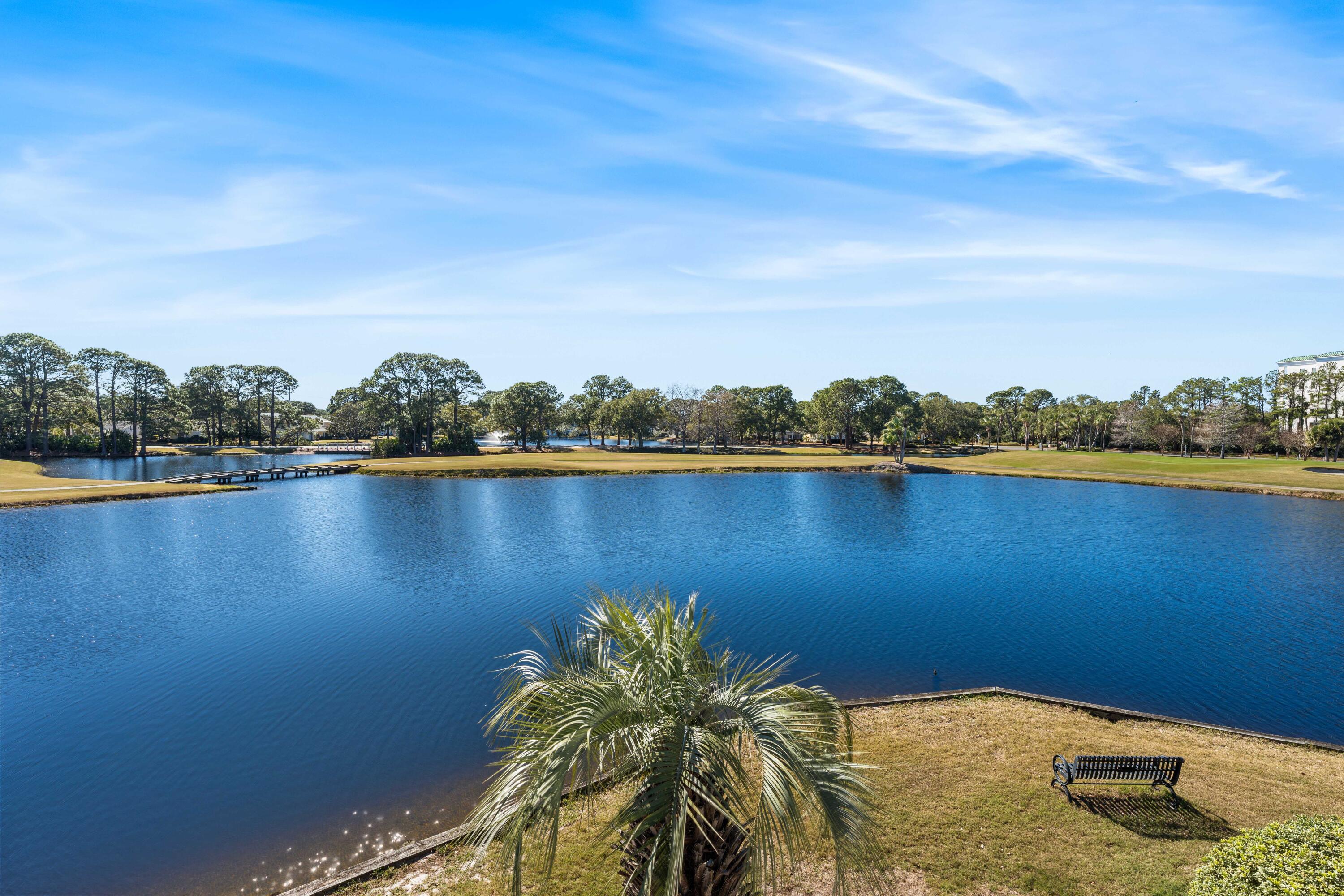 911 Harbour Point Lane, Unit 911 Miramar Beach, FL 32550 - Photo 21 of 40 a view of a lake with houses in the background