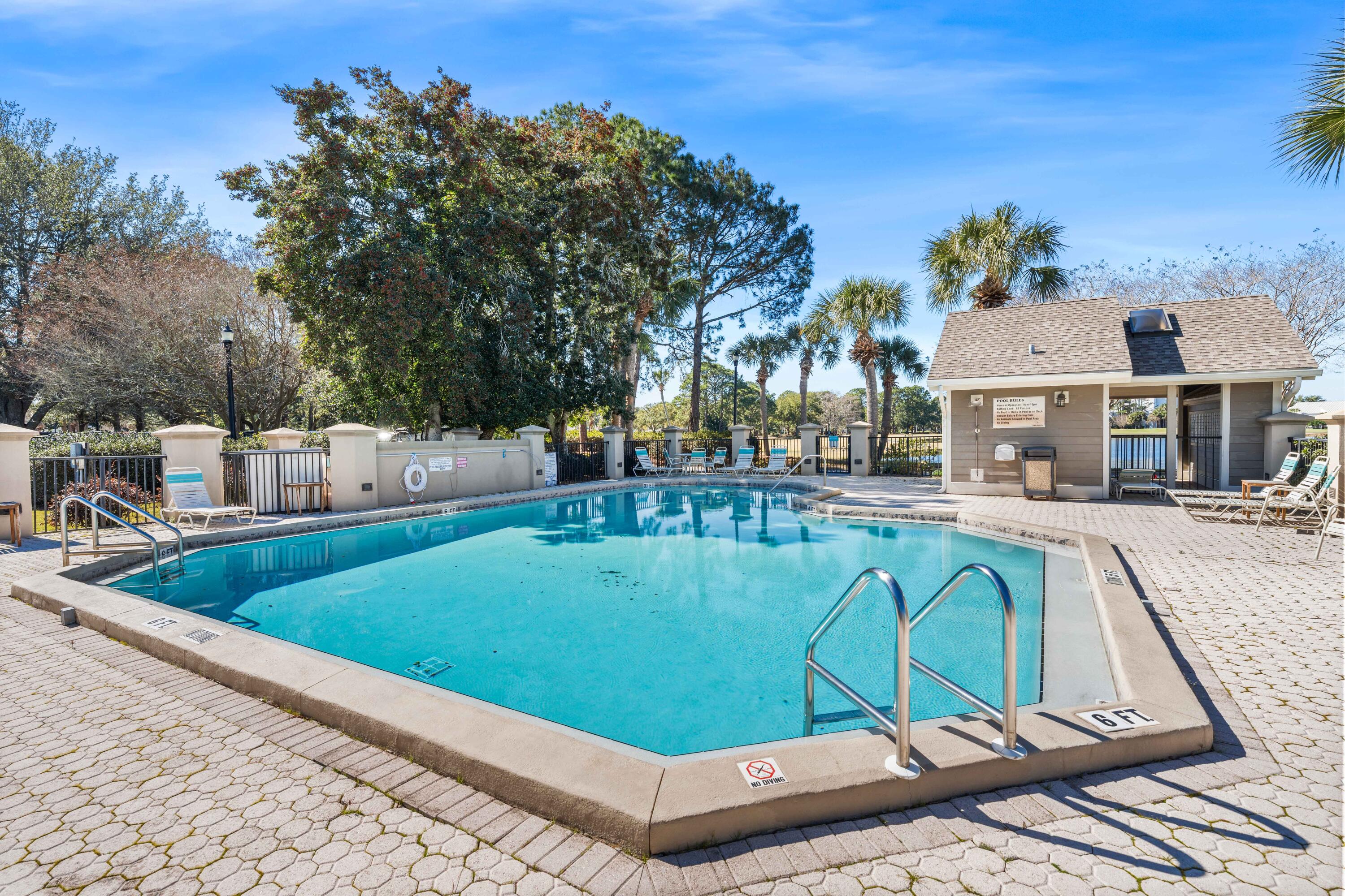 911 Harbour Point Lane, Unit 911 Miramar Beach, FL 32550 - Photo 23 of 40 a view of a swimming pool with a patio