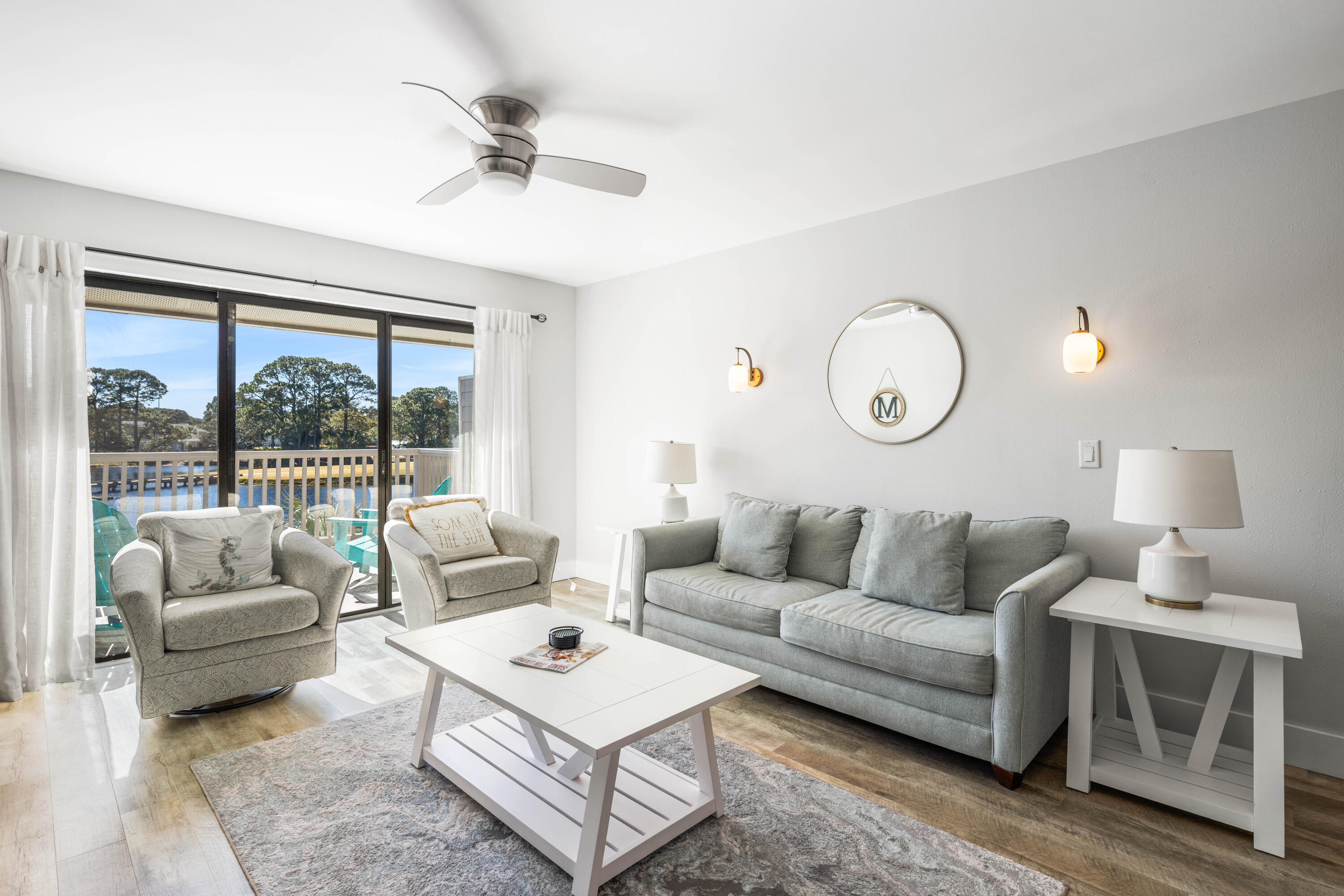 911 Harbour Point Lane, Unit 911 Miramar Beach, FL 32550 - Photo 4 of 40 a living room with furniture and a large window