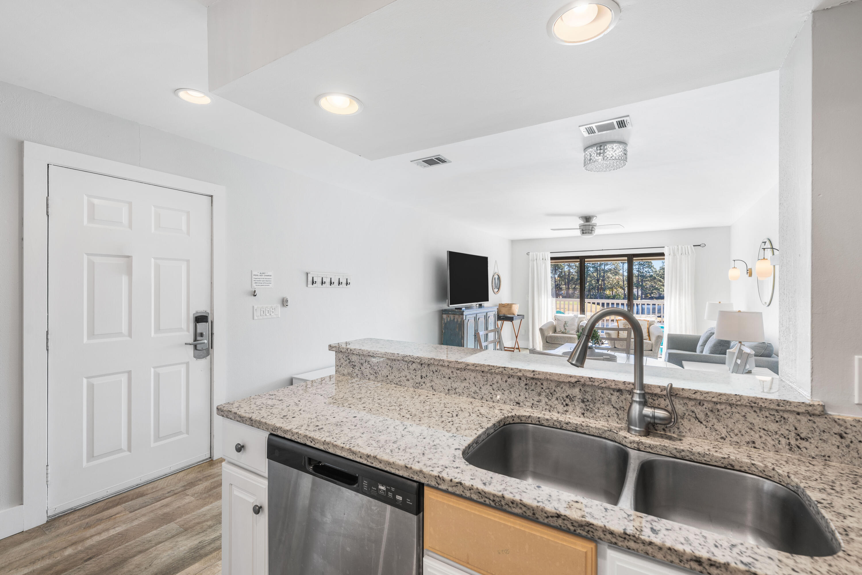911 Harbour Point Lane, Unit 911 Miramar Beach, FL 32550 - Photo 10 of 40 a kitchen with a sink and a refrigerator