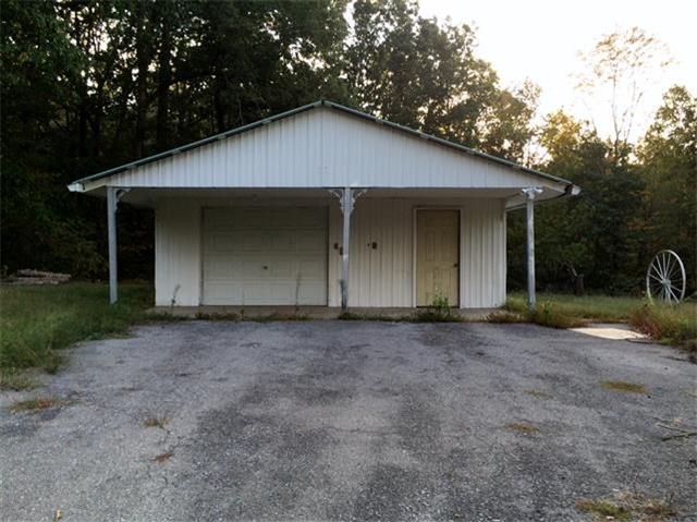 136 Big A Road Dover, TN 37058 - Photo 4 of 14 Nice 24'x24' detached garage with work bench & electric.
