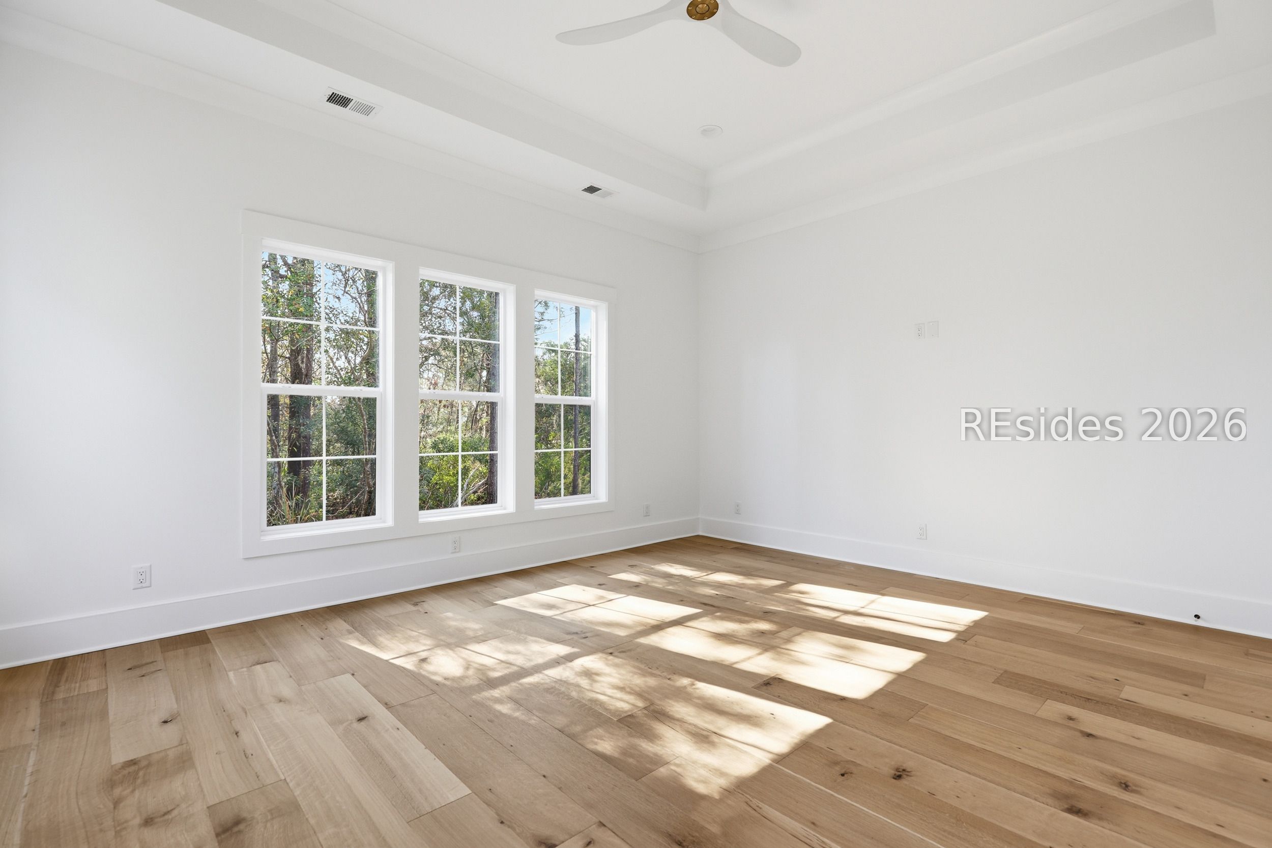 202 Fording Trace Bluffton, SC 29910 - Photo 21 of 52 Primary bedroom suite with view of the woods.