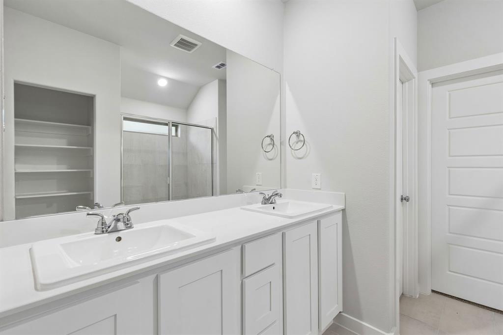 2305 Wind River Road Princeton, TX 75407 - Photo 16 of 32 Primary Bathroom in the Oscar home plan by Trophy Signature Homes – REPRESENTATIVE PHOTO