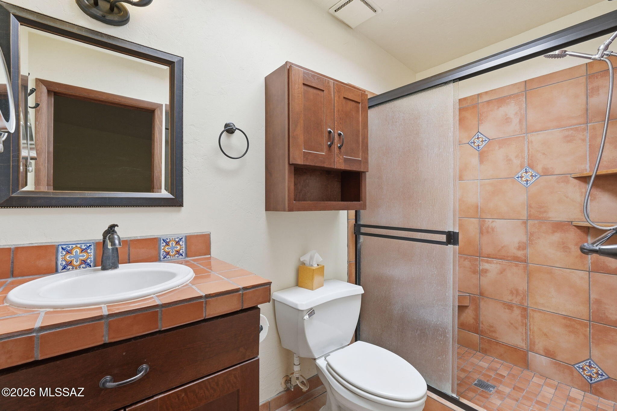 1125 East Kleindale Road Tucson, AZ 85719 - Photo 20 of 49 a bathroom with a toilet a sink and mirror