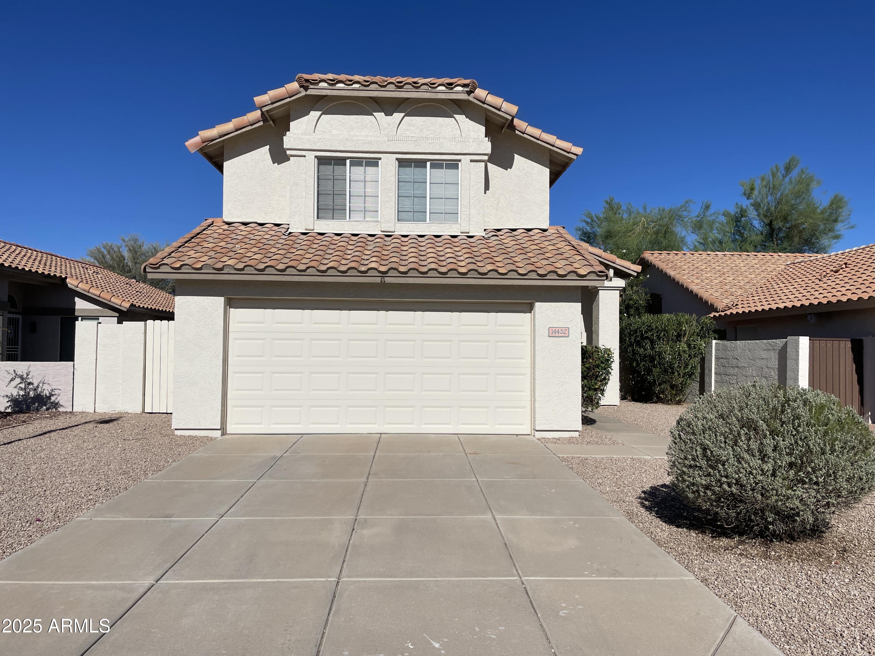 14452 South 43rd Street Phoenix, AZ 85044 - Photo 1 of 33 a front view of a house with a garage
