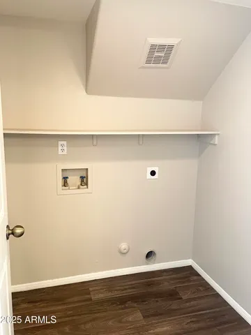 a view of room with window and wooden floor