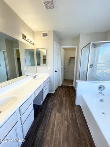 a bathroom with a sink a mirror and a toilet