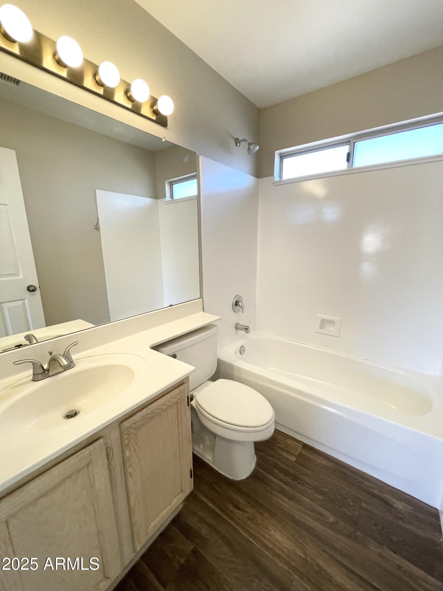 14452 South 43rd Street Phoenix, AZ 85044 - Photo 26 of 33 a bathroom with a double vanity sink and a bathtub