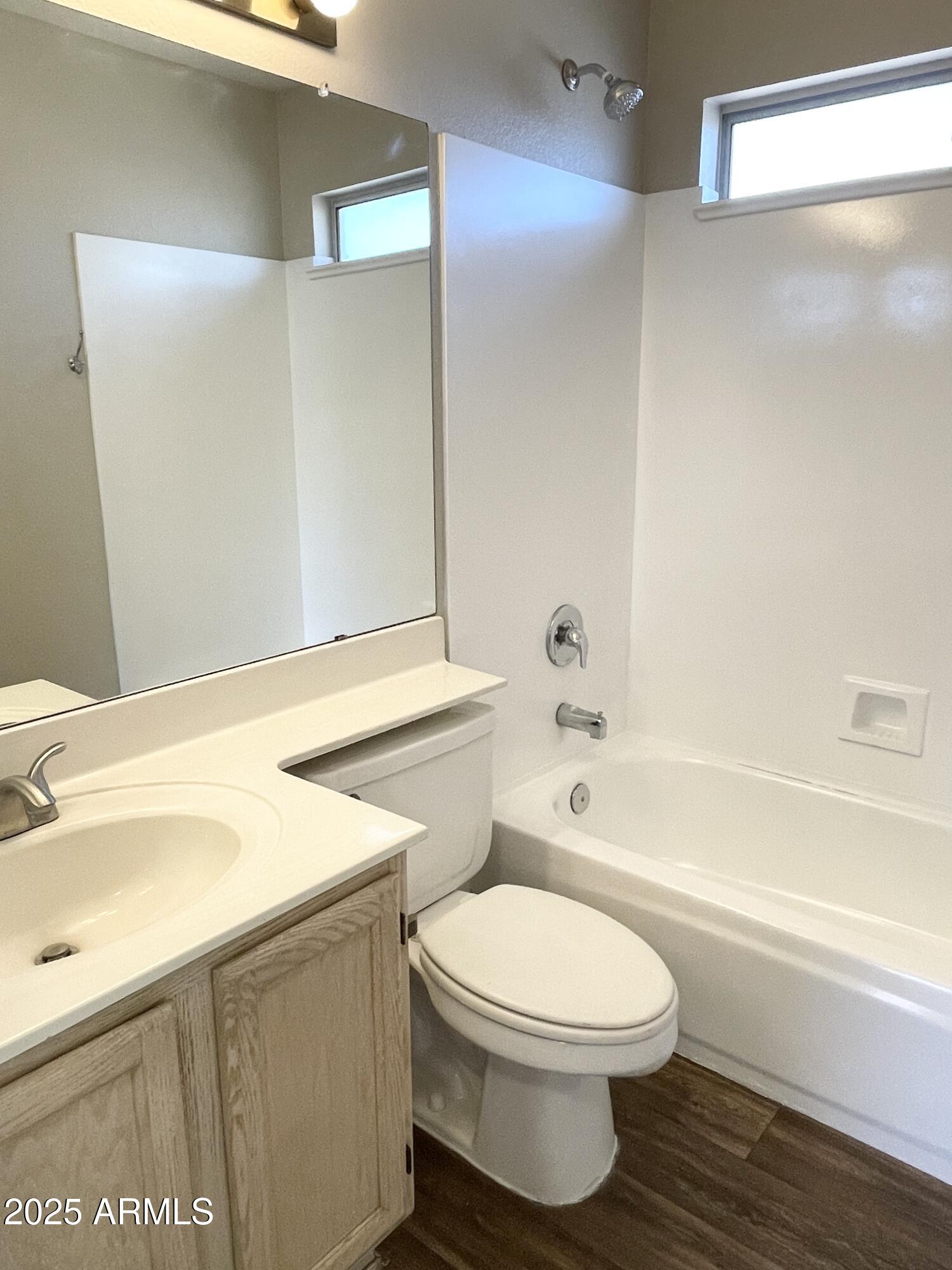 14452 South 43rd Street Phoenix, AZ 85044 - Photo 27 of 33 a bathroom with a toilet a sink and bathtub